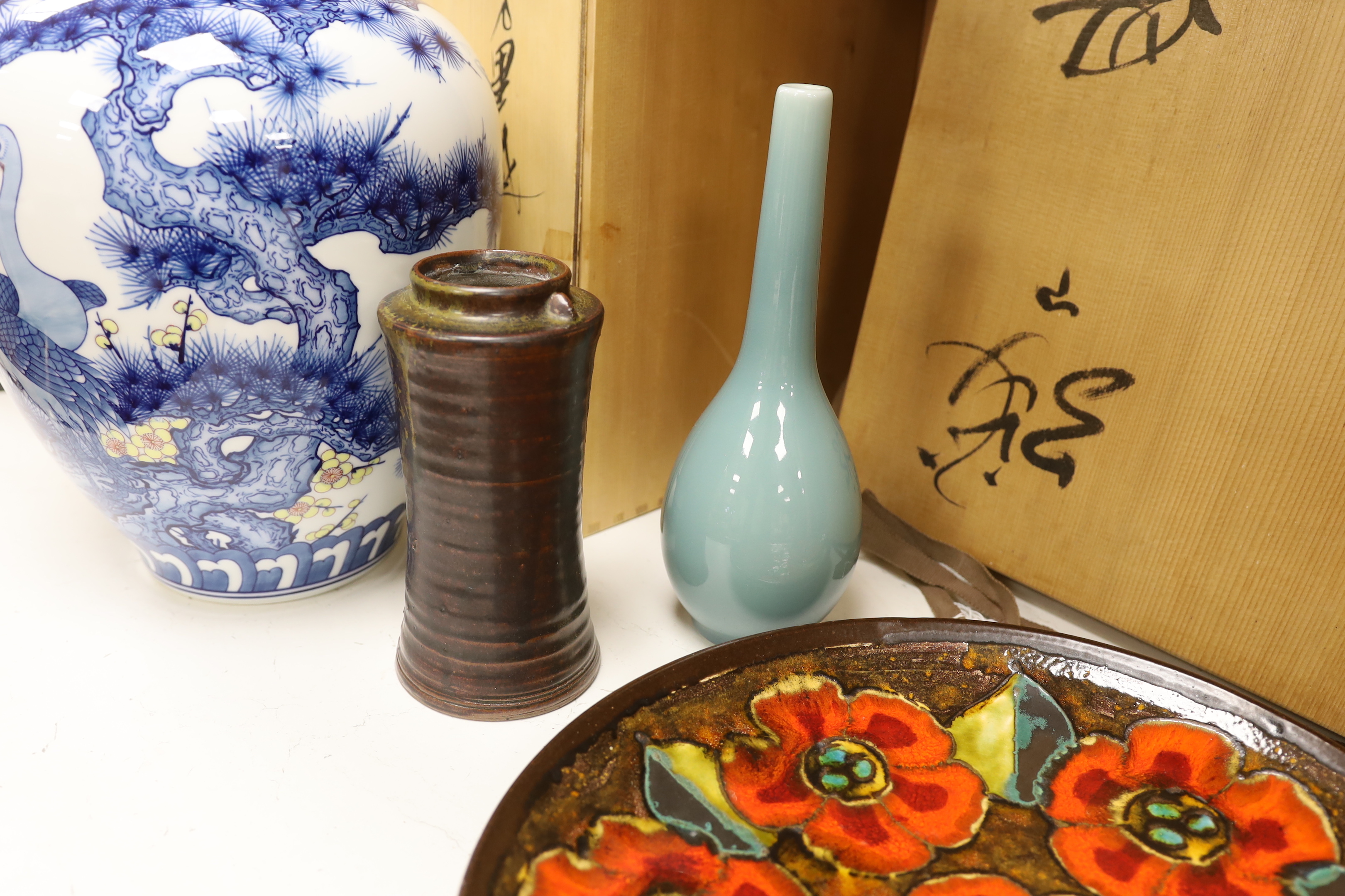 A Japanese blue and white ‘crane’ vase with wooden box, two other Japanese vases and an enamelled dish, also with wooden box. Dish 35cm diameter